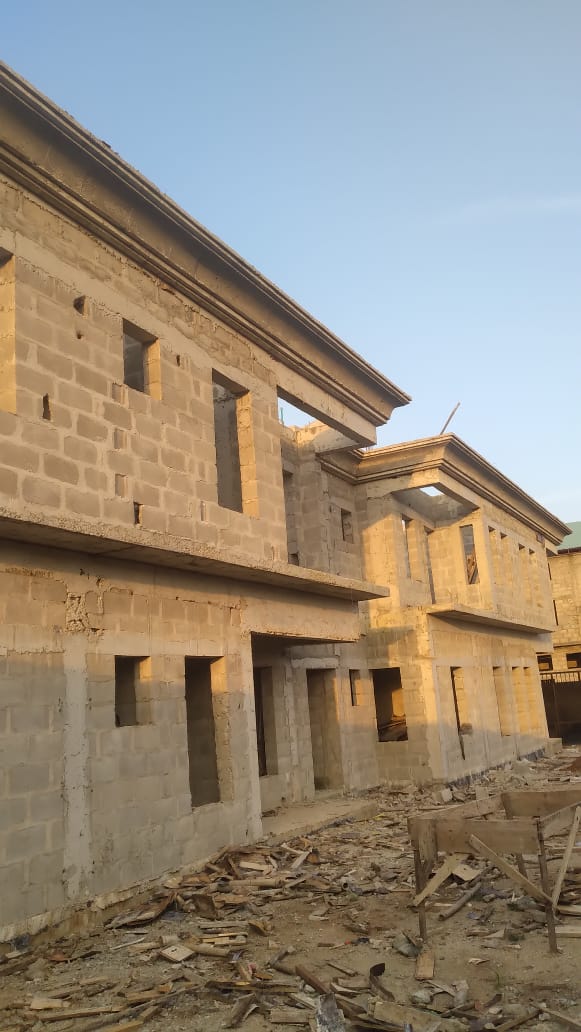 Building Before Construction of the Roof Carcass